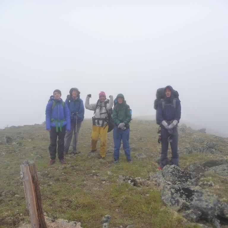 wet hikers in fog